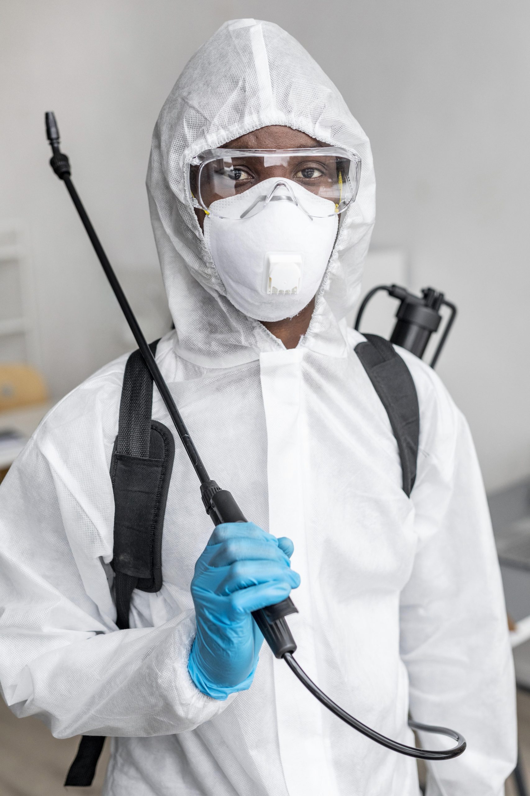 person-disinfecting-restricted-area